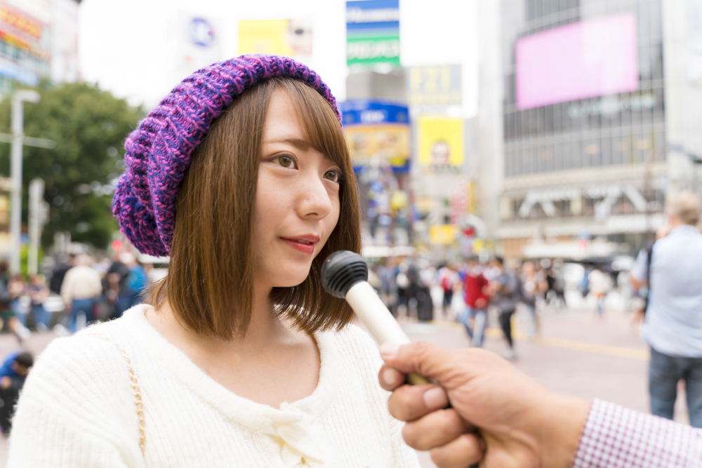 woman being interviewed on the street