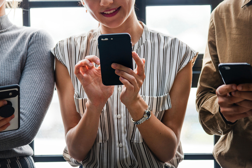 Young woman using phone