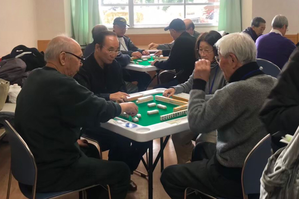 seniors playing table game