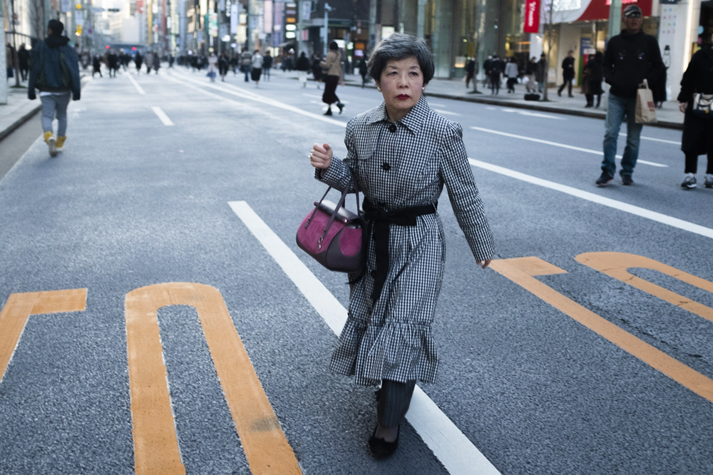 japanese woman walking accross street